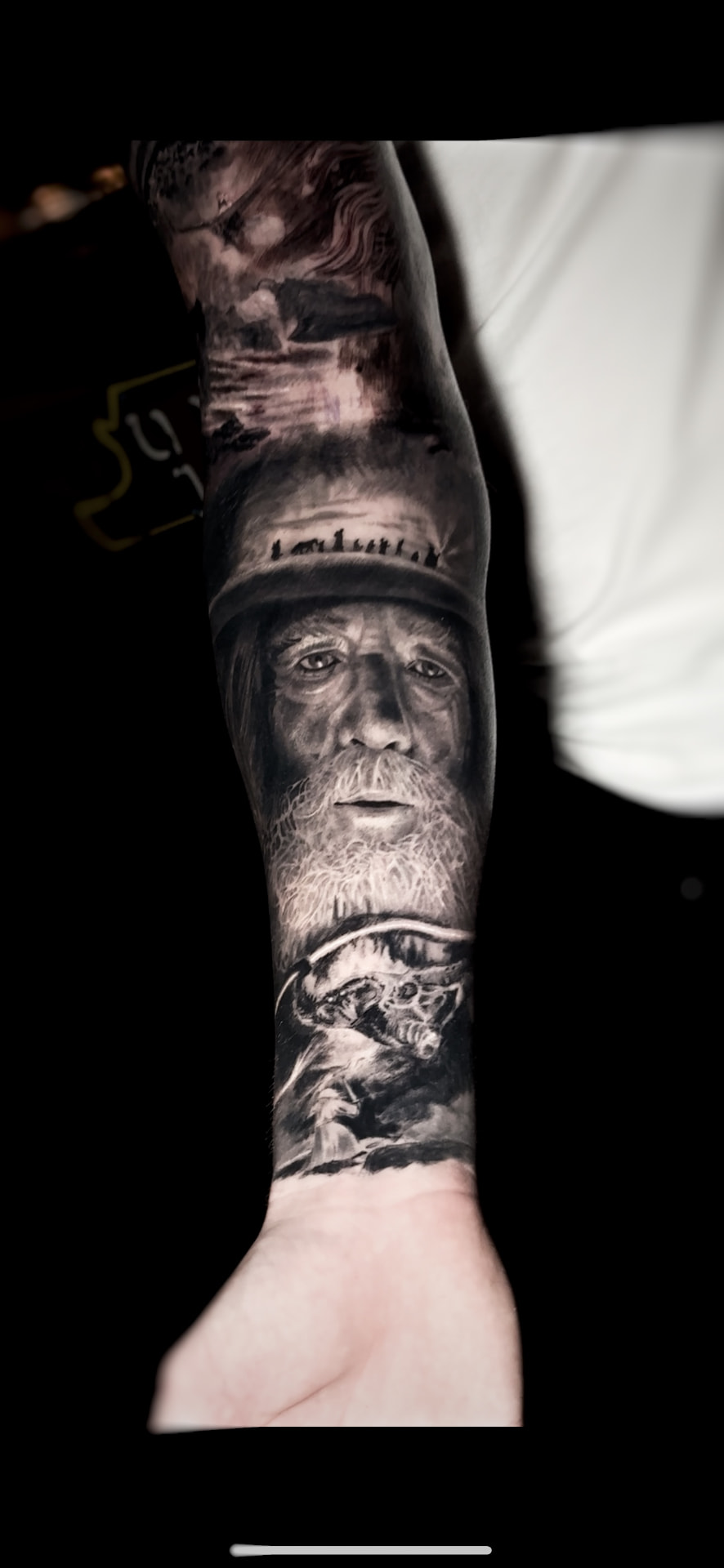 Black and grey wizard portrait forearm